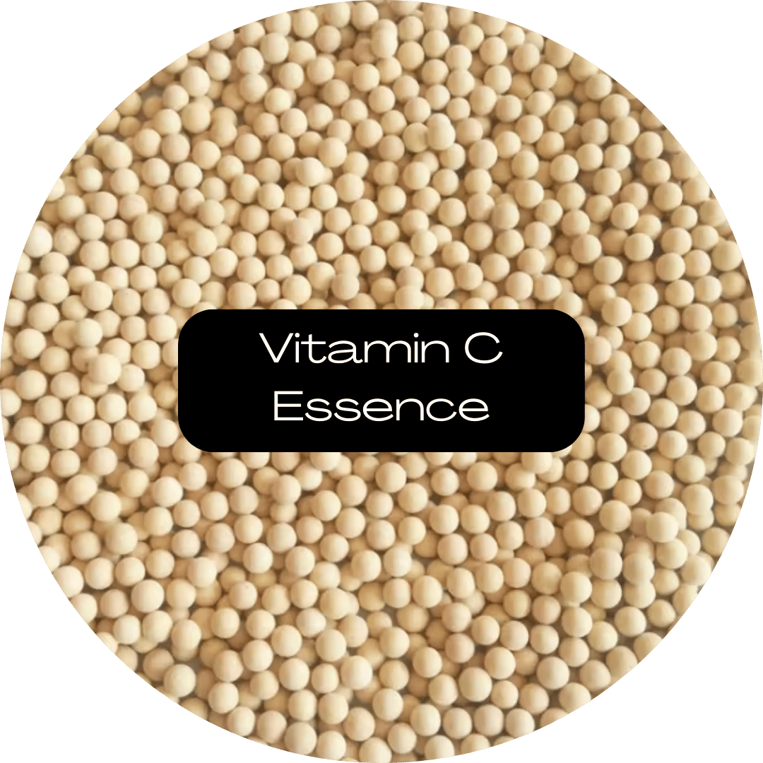 Pale yellow vitamin C essence beads with a central black label.